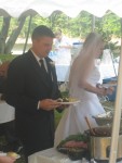 Bride and groom getting some food