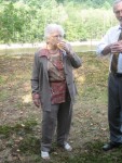 Hazel (Emily's grandma) drinking to a toast