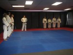 Lining up before getting our belts (candidates on the right)