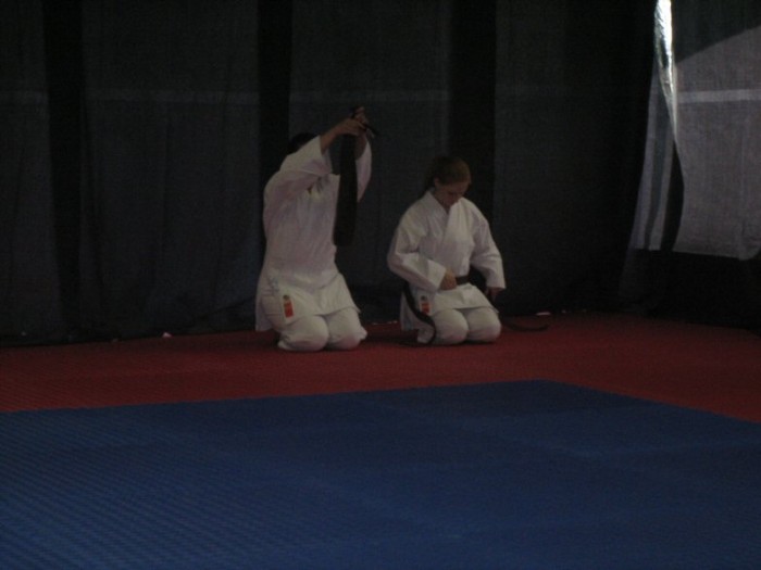 Cathy and Emily removing their brown belts