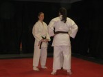 Cathy and Emily getting the pep talk from Sensei Steve before sparring