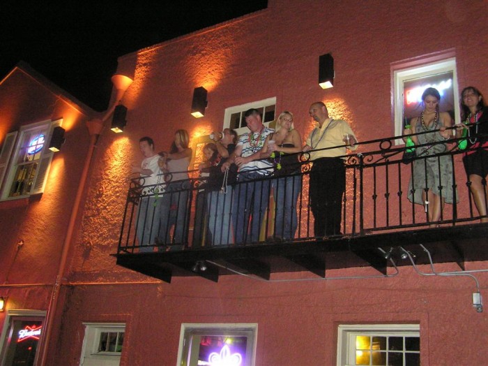 Some people on one of the balconies.