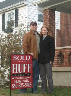 Us by our SOLD sign!