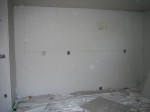 Kitchen wall (fridge will go on left, stove in middle w/microwave above-where yellow wire is)