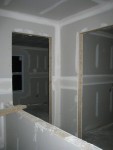 Looking from guest bathroom into laundry room (right) and guest room (left)