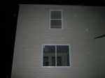 Back of house; family room window, guest room window