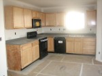 Kitchen with cabinets and appliances!