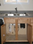 Disposal and faucet installed under kitchen sink