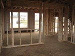 From family room, into living room.  2 windows and front door.  