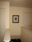 We hung the picture that everyone signed at our wedding in the stairway.  We get to look  at it every time we go down the stairs :-)