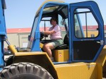 Becky coaxed the forklift guys to let her drive a lift.  Not this one though!