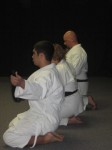 Everyone removing their belts; Shaunee gets her 2nd degree black belt, and Dustin got his 3rd degree black belt