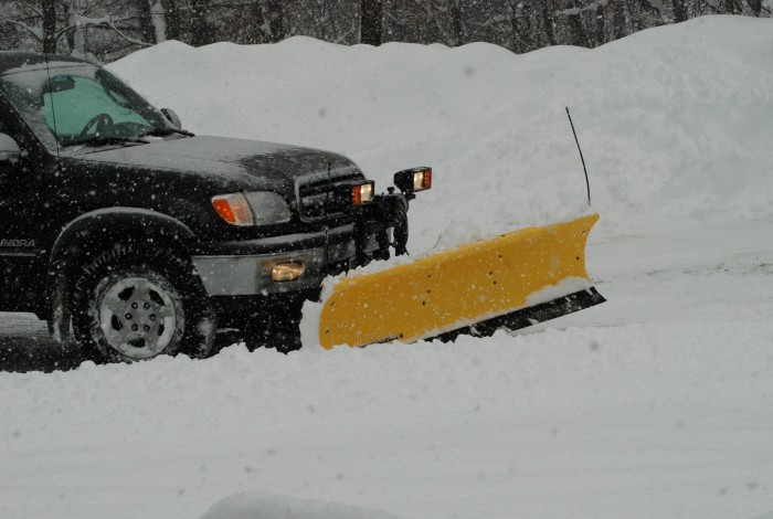 Emily's dad plowing the driveway