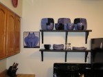 we hung shelves above the stove to display our dishes.  We got the dishes as wedding presents.