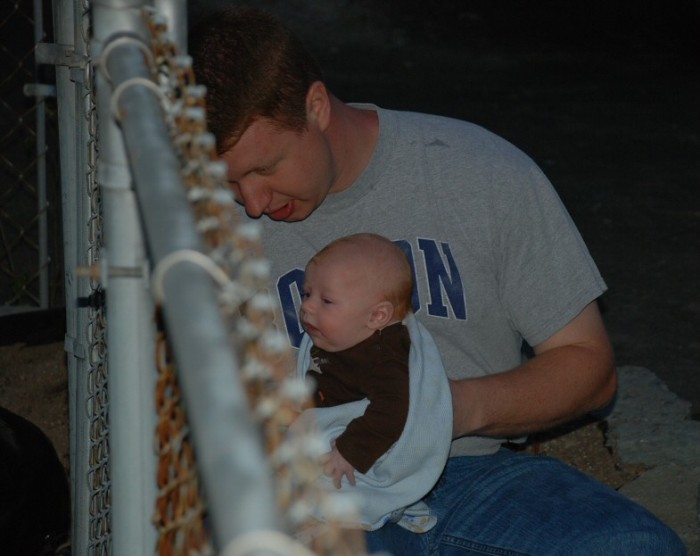 Uncle Brian teaching Sean about dogs.  Sean loved watching the 3 labs through the fence, and actually cried when Brian tried to stand up to leave!