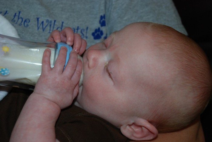 He likes to try to hold his bottle now