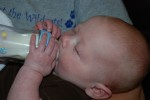 He likes to try to hold his bottle now