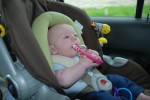 Sean playing with his rattle on the way home from St. Louis