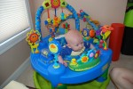 Sean liked playing in Reagan's exersaucer