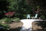 Patio and more fill dirt.  The crepe myrtle and small garden was enlarged and 2 large grasses moved closer to the patio