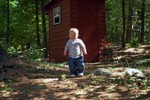 Checking out the outhouse by Opa's camp